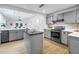 Modern kitchen features a functional island and stainless steel appliances at 1753 San Mateo Dr, Dunedin, FL 34698