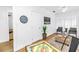 Spare living room with dartboard, comfortable chairs, bright light and game table at 1753 San Mateo Dr, Dunedin, FL 34698