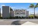 Legacy Groves community sign surrounded by lush green landscaping, offering an inviting entrance at 17881 Star Ruby Pl, Nokomis, FL 34275