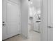 Clean laundry room with new washer and dryer and plenty of storage at 17881 Star Ruby Pl, Nokomis, FL 34275