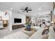 Bright living area boasts open layout to dining and kitchen, contemporary décor, lots of light and modern finishes at 17881 Star Ruby Pl, Nokomis, FL 34275