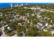 Aerial view of neighborhood, skyline and bay in distance, with plenty of mature trees at 1805 W Jetton Ave, Tampa, FL 33606