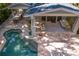 Aerial view showcasing the pool, outdoor kitchen, and covered patio area at 1805 W Jetton Ave, Tampa, FL 33606