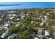 Aerial view of neighborhood, surrounding water, and plenty of trees on a sunny day at 1805 W Jetton Ave, Tampa, FL 33606