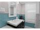 Updated bathroom featuring a subway tile backsplash, and classic fixtures at 1805 W Jetton Ave, Tampa, FL 33606