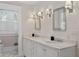 Bathroom features marble countertops, double sinks, and updated lighting at 1805 W Jetton Ave, Tampa, FL 33606