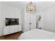 Bright bedroom with detailed millwork, hardwood floors, and view of the stairs at 1805 W Jetton Ave, Tampa, FL 33606