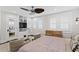 Bedroom features built-in shelving, shuttered windows and neutral furnishings at 1805 W Jetton Ave, Tampa, FL 33606