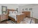 Bedroom with a craftsman-style bed and dressers, decorative rug, and plantation shutters at 1805 W Jetton Ave, Tampa, FL 33606