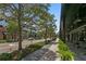 Street view of shops with sidewalks, trees, and road that creates a lively community atmosphere at 1805 W Jetton Ave, Tampa, FL 33606