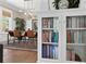 Bright dining room showcases modern light fixture, decorative plates, and view of the bookcase at 1805 W Jetton Ave, Tampa, FL 33606