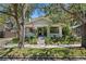 Charming home with a spacious front porch, American flag, and lovely landscaping at 1805 W Jetton Ave, Tampa, FL 33606