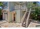 Exterior view of guest house with stairs to a second story deck at 1805 W Jetton Ave, Tampa, FL 33606