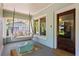 Relaxing porch with swing, chairs, and a view into the home through a paneled front door at 1805 W Jetton Ave, Tampa, FL 33606