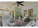Inviting front porch featuring cozy seating, a swing bed, and pleasant decor for relaxation at 1805 W Jetton Ave, Tampa, FL 33606