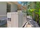 View of the home's generator and surrounding landscaping at 1805 W Jetton Ave, Tampa, FL 33606