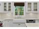 Bright kitchen with a farmhouse sink, stainless steel appliances, and abundant natural light at 1805 W Jetton Ave, Tampa, FL 33606