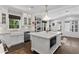 Beautiful kitchen with stainless appliances, marble countertops, farmhouse sink, and built-in shelves at 1805 W Jetton Ave, Tampa, FL 33606