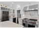 Beautiful kitchen with stainless appliances, marble countertops, and custom cabinetry at 1805 W Jetton Ave, Tampa, FL 33606