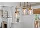 Modern light fixture brightens a living space with detailed millwork and natural light at 1805 W Jetton Ave, Tampa, FL 33606