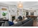 Elegant living room with hardwood floors, a fireplace, stylish decor, and a connected dining area at 1805 W Jetton Ave, Tampa, FL 33606