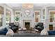 Inviting living room featuring a cozy fireplace, comfortable seating, and natural light at 1805 W Jetton Ave, Tampa, FL 33606