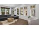 Comfortable living room with hardwood floors, a cozy sectional sofa, and French doors to a patio at 1805 W Jetton Ave, Tampa, FL 33606