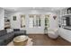 Bright living room with built-in shelving, hardwood floors, and French doors to the outdoor area at 1805 W Jetton Ave, Tampa, FL 33606