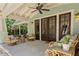 Inviting outdoor living space featuring comfortable seating and ceiling fan at 1805 W Jetton Ave, Tampa, FL 33606