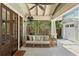 Relaxing outdoor living space with comfortable seating and decorative screen at 1805 W Jetton Ave, Tampa, FL 33606