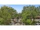 Aerial view of a town center featuring trees, benches, a fountain and businesses at 1805 W Jetton Ave, Tampa, FL 33606