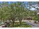 Town center featuring large trees, benches, lawn, a fountain and storefronts at 1805 W Jetton Ave, Tampa, FL 33606