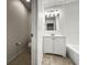 Compact bathroom with clean lines featuring toilet, vanity, and shower-tub combo at 1880 Fuller Dr, Clearwater, FL 33755