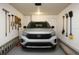 The garage features a car, tools hanging on the wall, and ladder on the floor at 1880 Fuller Dr, Clearwater, FL 33755