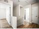 Hallway with wood floors leading to bedrooms and bathrooms upstairs at 1880 Fuller Dr, Clearwater, FL 33755