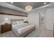 Bedroom with decorative light fixture, soothing color scheme, and matching nightstands at 18913 Indian Rock Pl, Lakewood Ranch, FL 34211