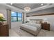 Bedroom with a decorative light fixture, soothing color scheme, large window, and matching nightstands at 18913 Indian Rock Pl, Lakewood Ranch, FL 34211