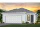 Charming one-story home with a two-car garage and manicured landscaping at 18913 Indian Rock Pl, Lakewood Ranch, FL 34211