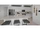 Bright kitchen with white cabinets, stainless steel appliances, and a large center island at 18913 Indian Rock Pl, Lakewood Ranch, FL 34211
