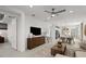 Open-concept living room connected to kitchen and dining area; neutral decor at 18913 Indian Rock Pl, Lakewood Ranch, FL 34211