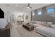 Bright open living area features modern decor, recessed lighting, and access to dining room and kitchen at 18913 Indian Rock Pl, Lakewood Ranch, FL 34211