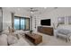 Inviting living room with stylish decor and a sliding glass door with lake view at 18913 Indian Rock Pl, Lakewood Ranch, FL 34211