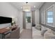 Office featuring a desk, seating, large window, soft color scheme, and artwork at 18913 Indian Rock Pl, Lakewood Ranch, FL 34211