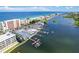 Breathtaking aerial view showcases waterfront property with dock, intercoastal access, and nearby beach at 20019 Gulf Blvd # 1, Indian Shores, FL 33785