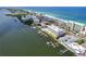 Stunning aerial view of waterfront property with private docks, intercoastal waterway, and beach access at 20019 Gulf Blvd # 1, Indian Shores, FL 33785