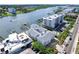 Gorgeous aerial view showcasing waterfront homes with private docks and beach access at 20019 Gulf Blvd # 1, Indian Shores, FL 33785