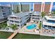 Charming waterfront property with private pool, patio seating, and lush landscaping at 20019 Gulf Blvd # 1, Indian Shores, FL 33785