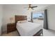 Bedroom featuring neutral tones, ceiling fan, and a beautiful view of the water at 20019 Gulf Blvd # 1, Indian Shores, FL 33785