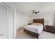 Comfortable bedroom with neutral tones, ceiling fan, and closet for ample storage at 20019 Gulf Blvd # 1, Indian Shores, FL 33785