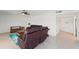 Living room featuring tile floors, comfortable leather seating, and coastal decor at 20019 Gulf Blvd # 1, Indian Shores, FL 33785
